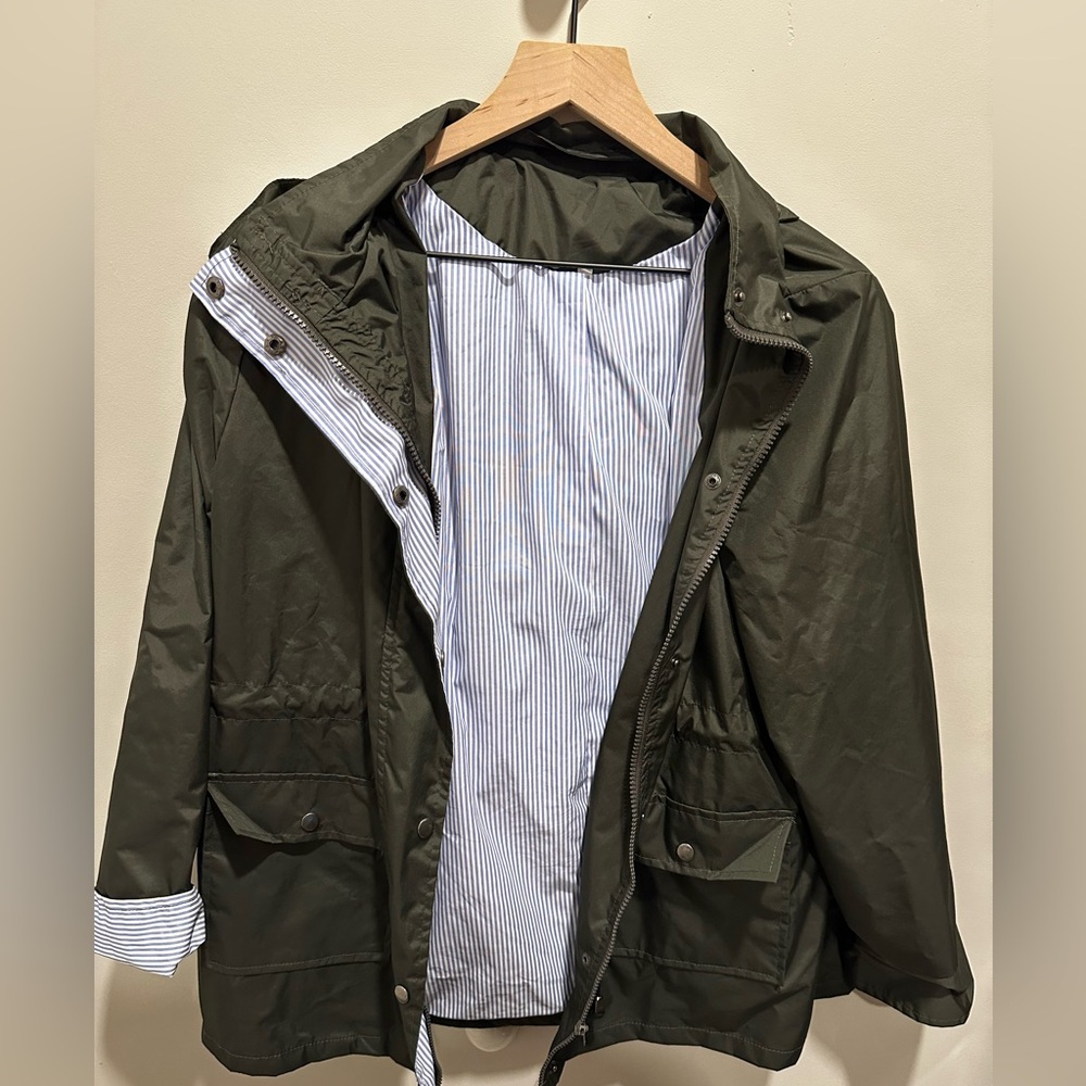Dark army green rain jacket. Light blue pin stripe inside. Size large.